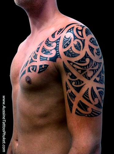 maori-tribal-tattoo-on-chest-and-left-arm.jpg